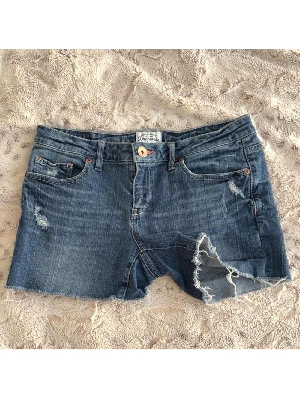 low rise aéropostale blue denim shorts with distressed details and pink hemline